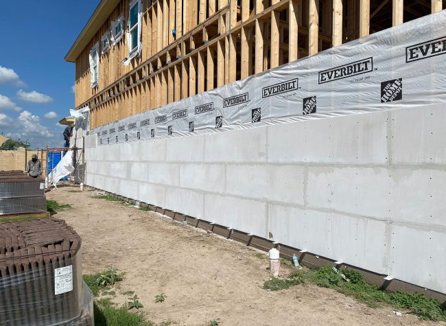 005 Autoclaved Aerated Concrete (AAC) is a lightweight building material made from a combination of sand, cement, lime, gypsum, and a small amount of aluminum powder.